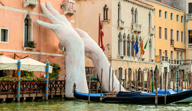 sculpted hands on venice city walls