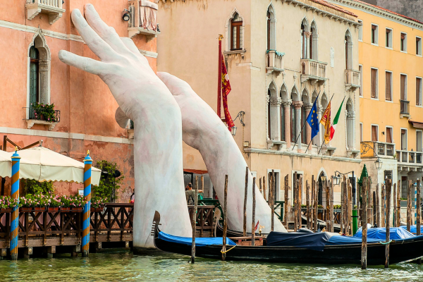 sculpted hands on venice city walls